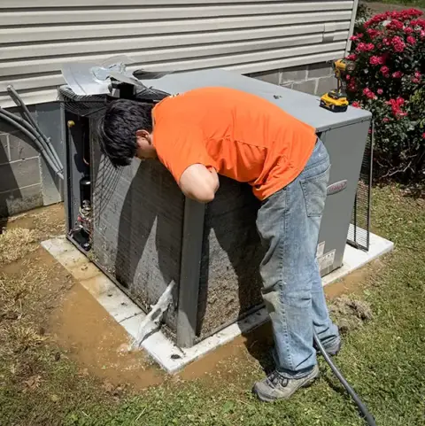 Loflin Heating & Air performs an air conditioner repair for a customer.